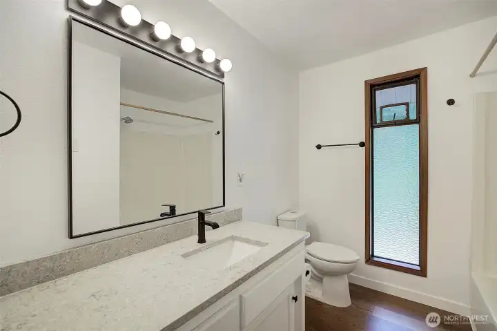 updated full bath in the hallway upstairs.