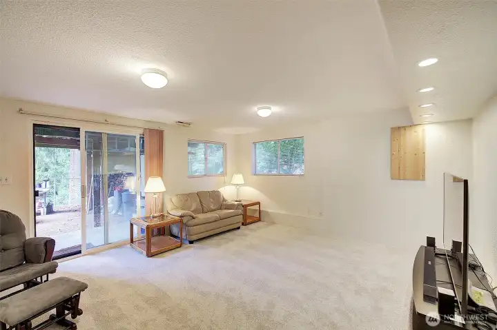 Downstairs family room slider walks out onto the back patio. Fresh paint and new carpet give this room a fresh clean feel.