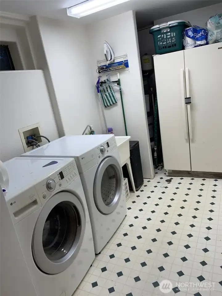 Utility room downstairs. Refrigerator/freezer to go with seller.