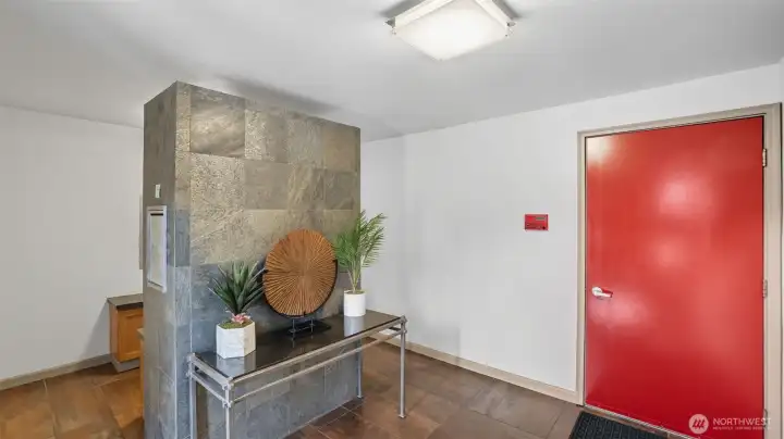Enter from main building entrance into the beautiful Lobby and then head downstairs to the street level condos.