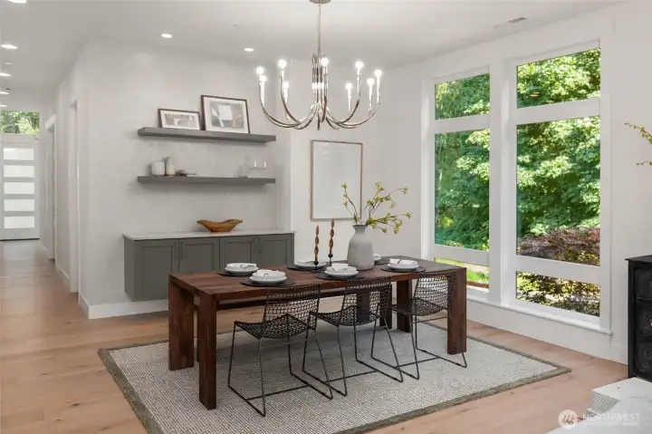 Dedicated Dining space flanked by custom floating cabinet and shelves with designer selected wallpaper feature wall