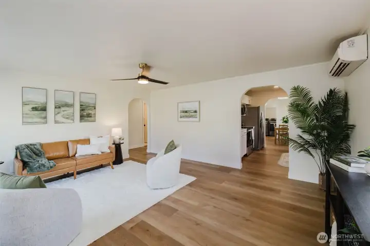 Large, open living space, arched doorways, new LVP throughout