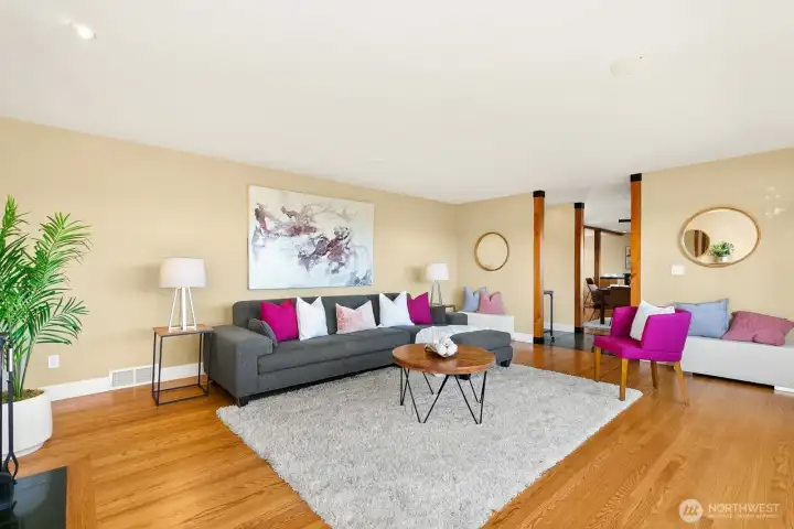 A view of living room towards eating area and kitchen.
