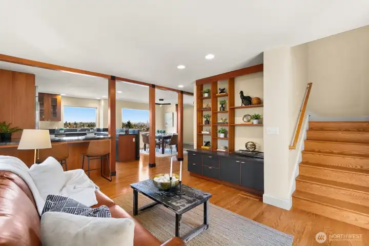 Another view of the TV/media area looking towards the kitchen.  There's even City views from the couch!  Lovely built-in shelves and bar seating.