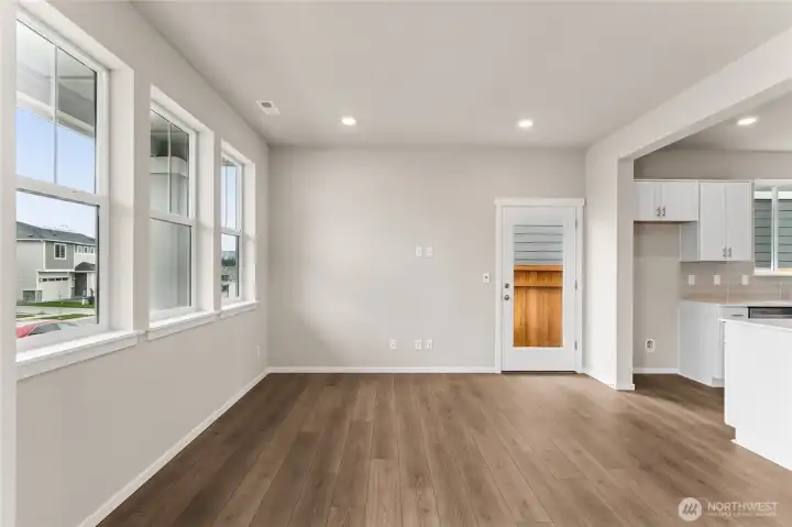 Enjoy quartz countertops, subway tile backsplash, and easy access to the walk-in pantry for added convenience.  Pictures are for representational purposes only, colors and features may vary.