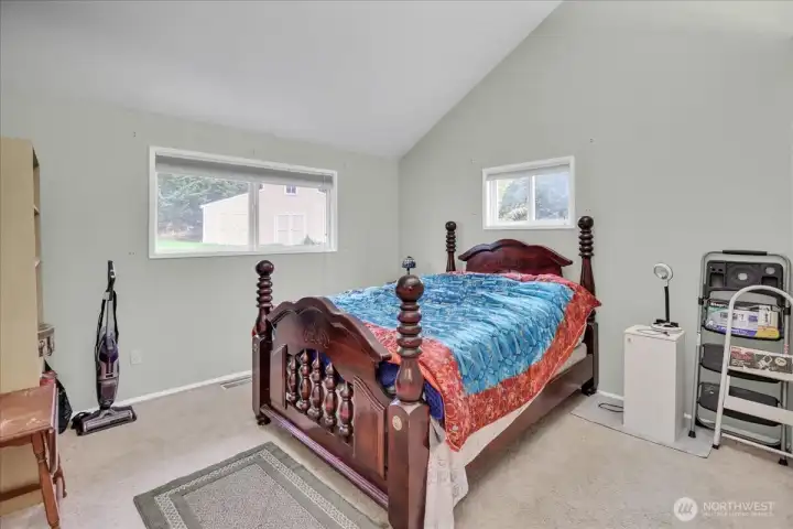Bedroom with vaulted ceilings.
