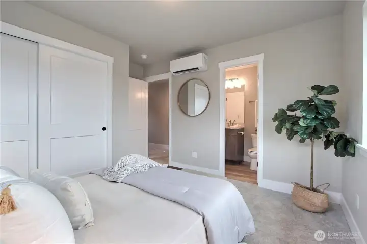 **Photos are of Unit B, for illustrative purposes only. Unit C has all the same finishes w/reversed floor plan.** Primary bedroom with direct access to full bath.