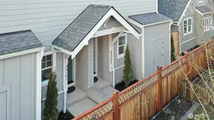 Covered entryway and exterior bike storage & utility closet.