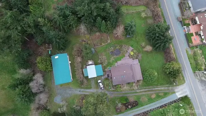 This aerial view shows the main house, outbuilding and large shop/studio.  The property is absolutely magical!
