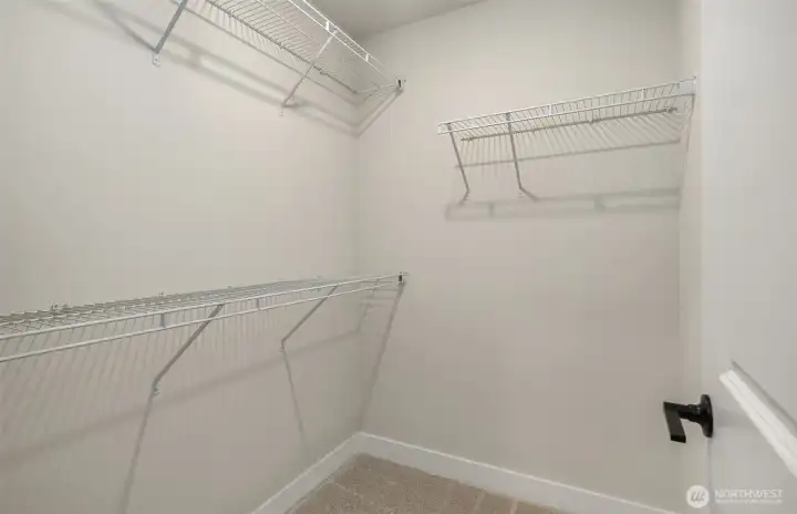 Walk-in closet in secondary bedroom suite