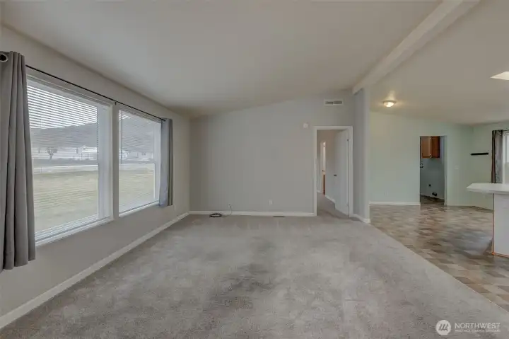 Family room with large windows and lots of natural light.