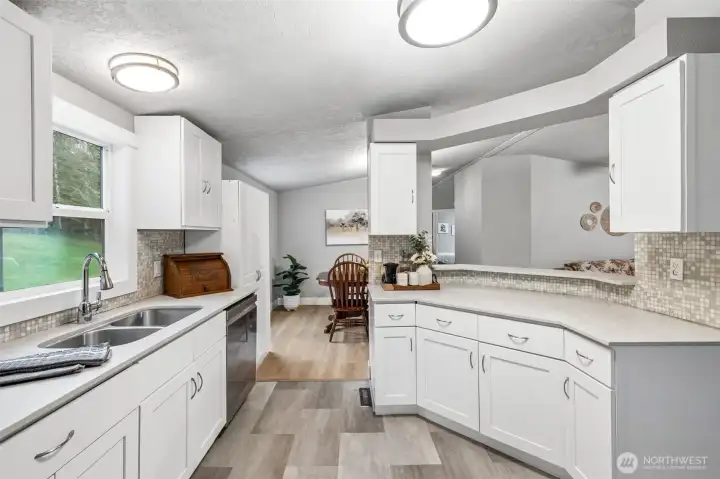 Ample counter space provides room for cooking, baking, and entertaining. The layout keeps everything within easy reach. It’s a kitchen that supports both everyday meals and special occasions.