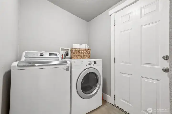 Laundry is located off of the kitchen in a separate room with back door access to the back deck and yard. A new hot water tank installed in 2025 provides efficiency and reliability. This major update offers peace of mind for years to come. It’s one less thing to worry about after move-in.