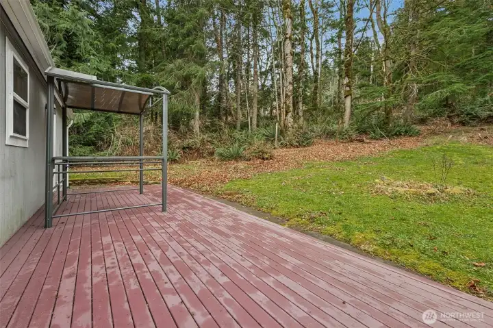 The expansive back deck offers a great space for gatherings and relaxation. The private, secluded setting provides a peaceful escape from city congestion. Surrounded by nature, the home offers a lifestyle rooted in quiet and space. It’s a retreat you’ll look forward to coming home to.