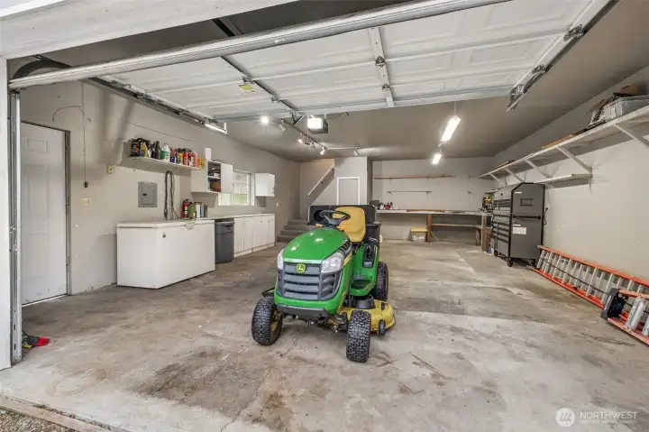 The riding lawnmower has low hours and remains with the home as a convenience to seller.