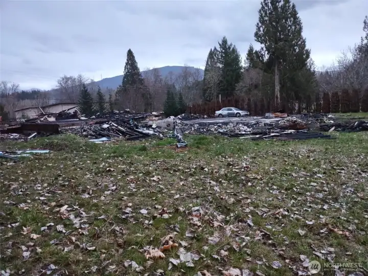 View from side corner of lot after structure fire 8/2025