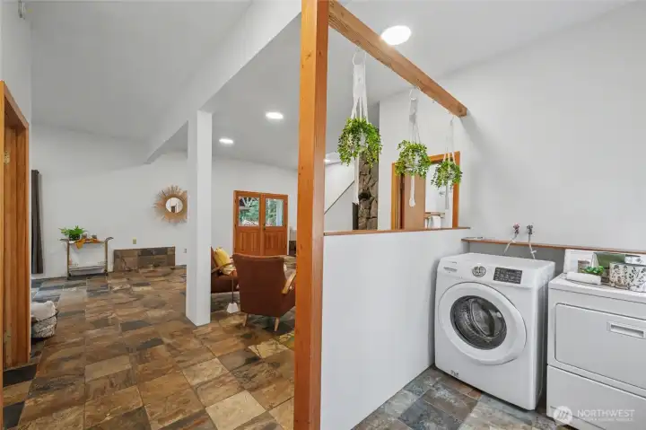 Laudrey area located just off the fully fenced back yard area and hot tub area.