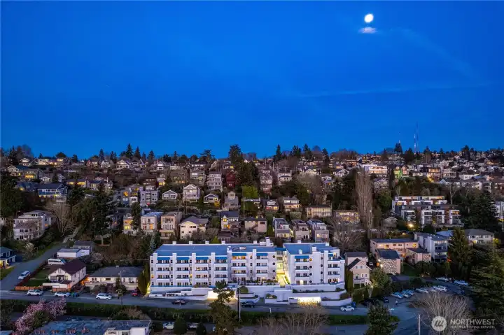 Set high above the neighborhood with views stretching across Smith Cove, Pier 91, and Interbay’s open fairways