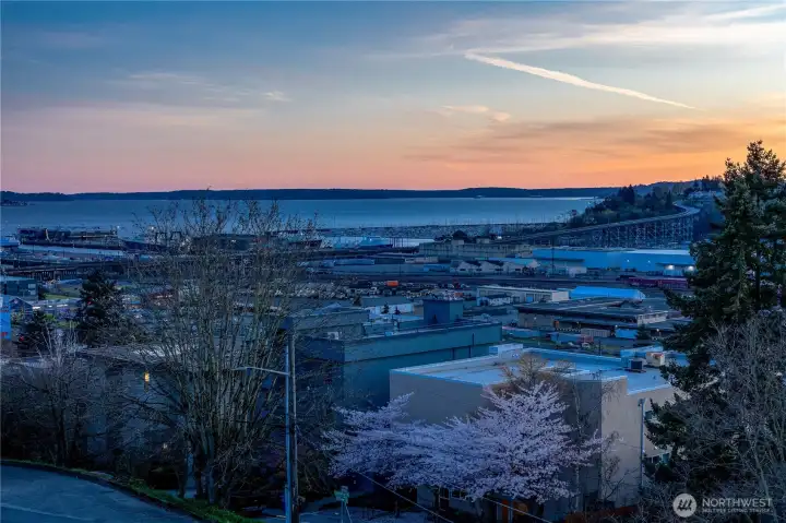 Sunsets settle over Puget Sound, with warm tones reflecting off the water and filling the space with a quiet glow