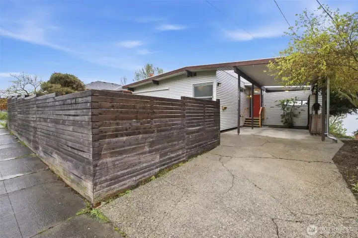 The house feels private from Waters Ave South with the fenced front yard.