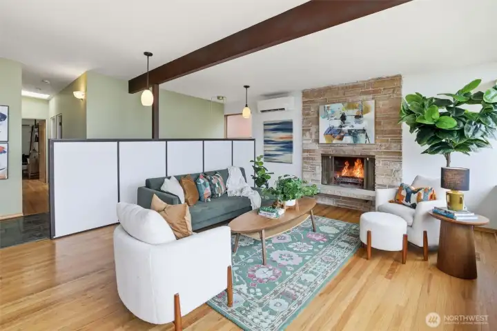Hardwood floors, fireplace and that view make this a very pleasant living room.