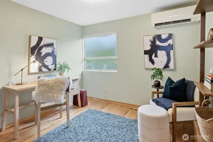 The third bedroom is staged as an office.