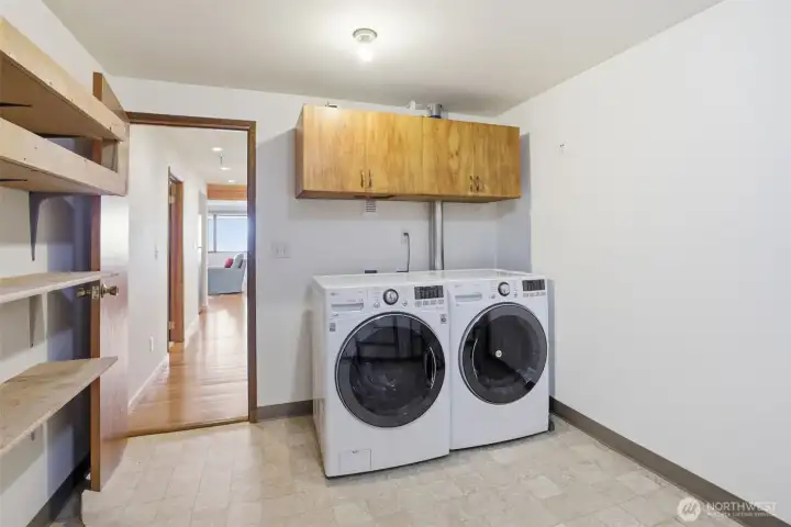 Washer and dryer in the large storage room.