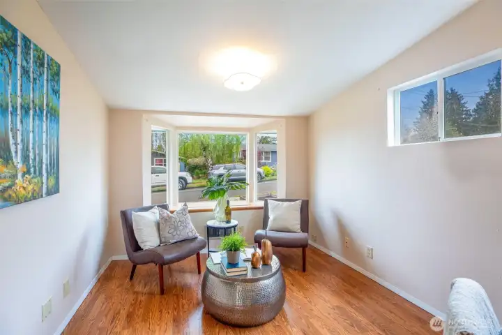 Bay window has hidden storage and great light to read your afternoon away