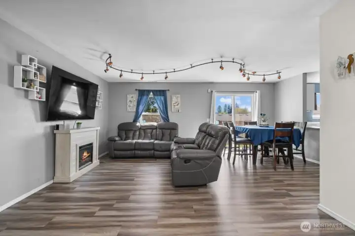 Great Room featuring brand-new flooring and abundant natural light.
