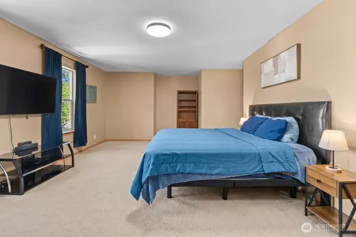 Primary Bedroom With Ample Space For A King-Sized Bed And Seating Area