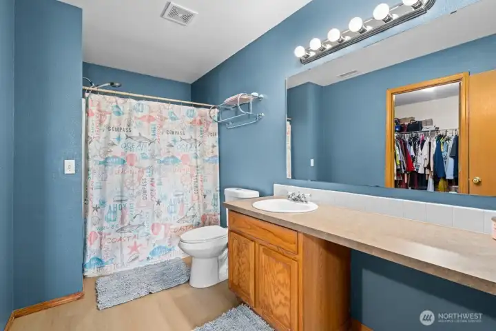 Extensive Primary Closet With Ample Room For All Your Wardrobe Needs