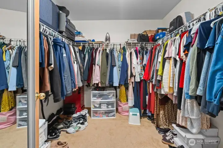 Extensive Primary Closet With Ample Room For All Your Wardrobe Needs