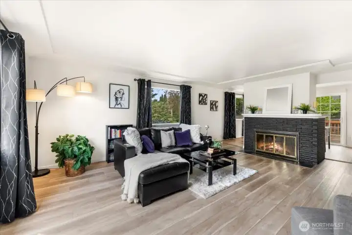 New LVP flooring in 2023. Tons of natural light flow through this gorgeous living room