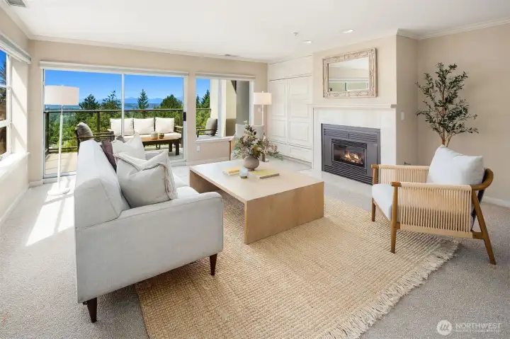 Living room with views, deck access and gas fireplace Living room with views, deck access and gas fireplace