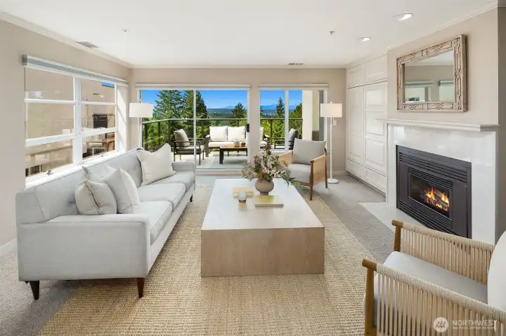 Living room with views, deck access and gas fireplace Living room with views, deck access and gas fireplace