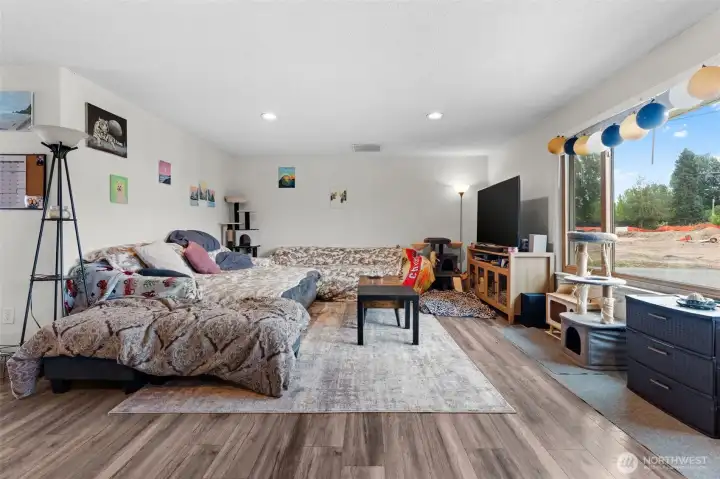 Spacious living room offers flexible furniture arrangement with a large picture window overlooking the front yard.