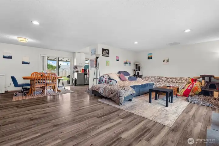 Large front-facing window and open floor plan create a comfortable, versatile living space.