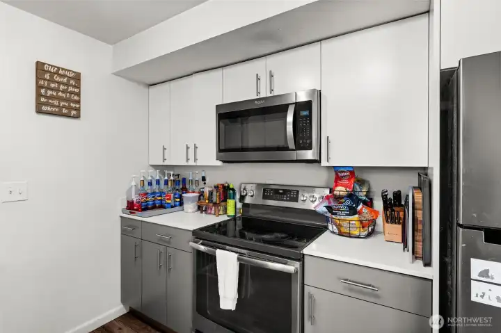 Open kitchen with updated cabinets, countertops, appliances, and fixtures!