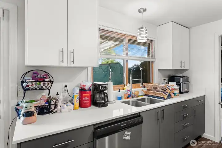 Open kitchen with updated cabinets, countertops, appliances, and fixtures!
