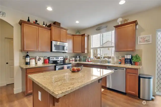 kitchen with plenty of cupboard and counter space. Double door pantry to the left of this view.