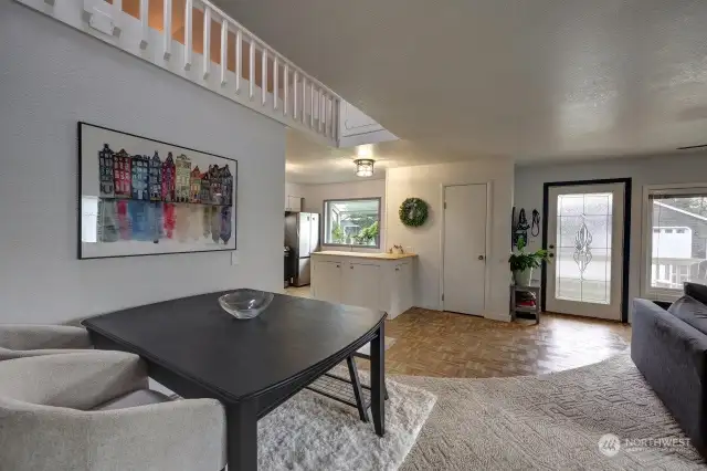 Dining area and kitchen with the main entry.