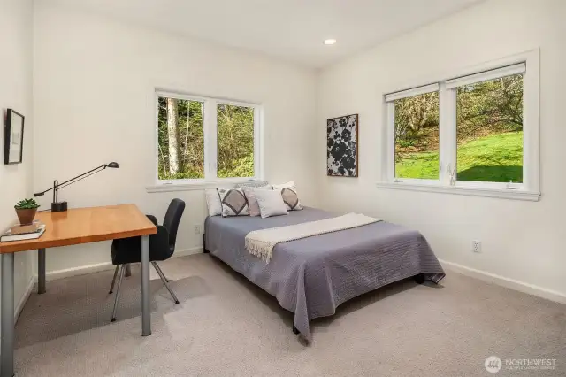 The main level bedroom also lives comfortably as den or office.