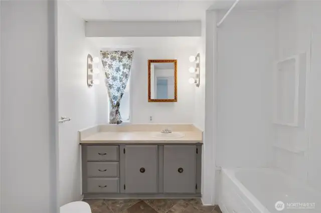 The hall has a spacious full bathroom...