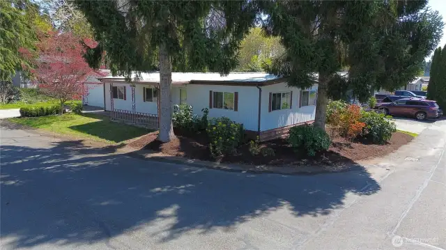 Situated on a beautifully landscaped corner lot that is easy to maintain.