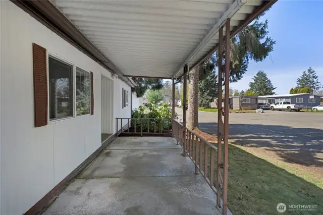 The main entrance has a covered patio...