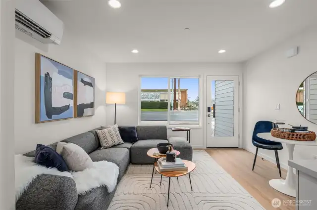 Step inside and feel right at home—this sunny living space perfectly blends modern simplicity and everyday comfort. Movie nights, morning coffee, or your latest read—this space has you covered.