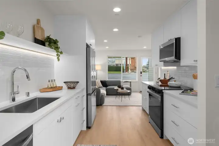 Photos of model home with similar finishes & floor plan. A full-circle moment: this open floor plan brings the whole vibe together, from prepping to lounging. It’s a perfect layout with just the right touch of style.
