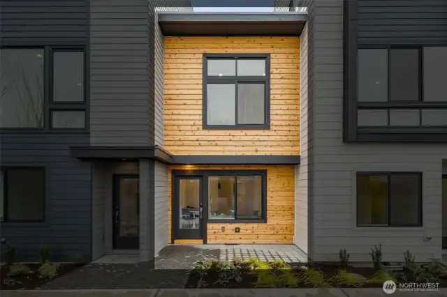 Say hello to your charming street-facing entrance! With its rich cedar tones and dark trim, this entry brings curb appeal and character to your front door.