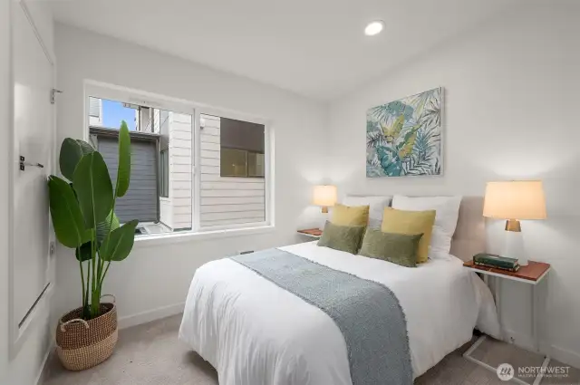 The second bedroom offers privacy and comfort, which is ideal for guests or a stylish home office setup.