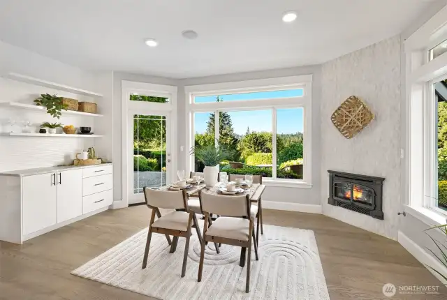 Dining nook off the kitchen that has doors to the expansive patio.